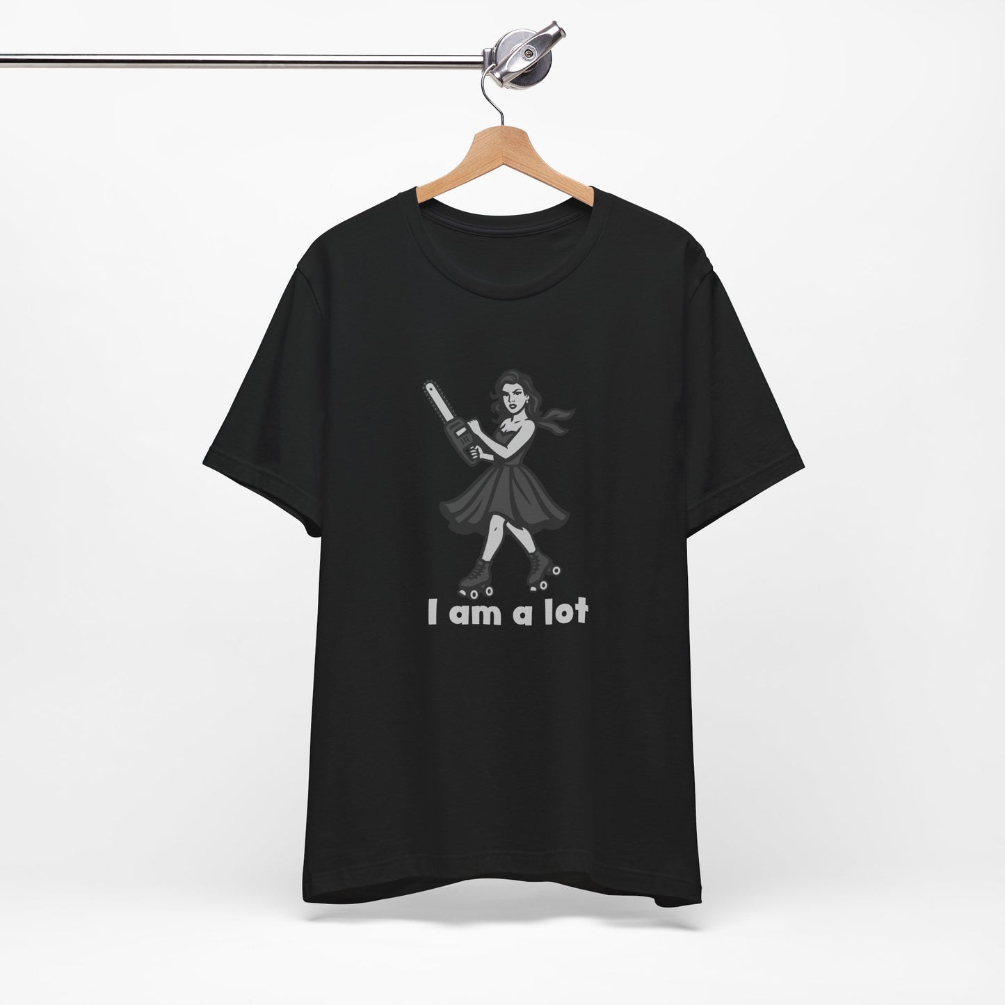 I Am a Lot Shirt – Fierce Skater Girl with Chainsaw in Dark Theme Retro Cartoon Style. Unisex Jersey Short Sleeve Tee