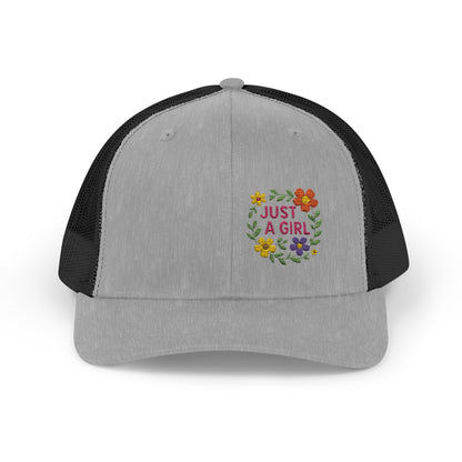 Just a Girl Trucker Hat – Colorful Floral Text Hat with Bold Feminine Style and Summer Vibes