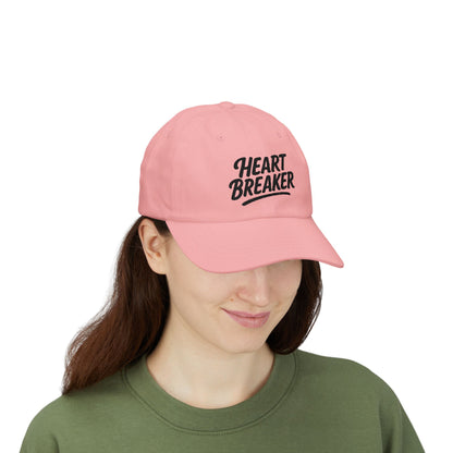 Heartbreaker Embroidered Classic Dad Hat – Bold Baseball Hat with Retro Script and Broken Heart Design for Confident Rule-Breakers. Black Letters