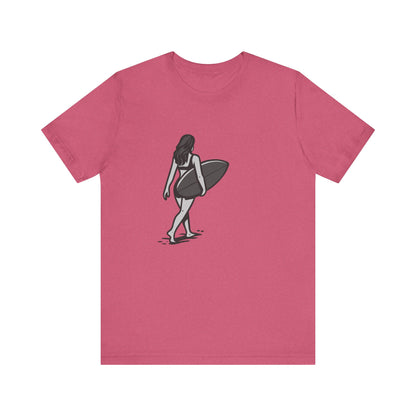 Surfer Girl Walking Graphic T-Shirt – Dark Theme Grayscale Beach Scene on Black Tee with Coastal Calm and Modern Ghost Effect. Unisex Jersey Short Sleeve Tee