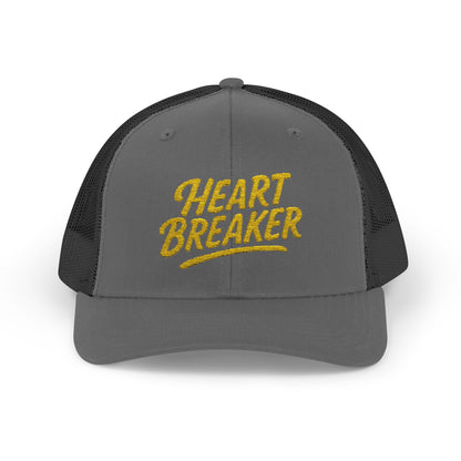Heartbreaker Trucker Hat – Bold Baseball Hat with Retro Script and Broken Heart Design for Confident Rule-Breakers. Yellow Letters