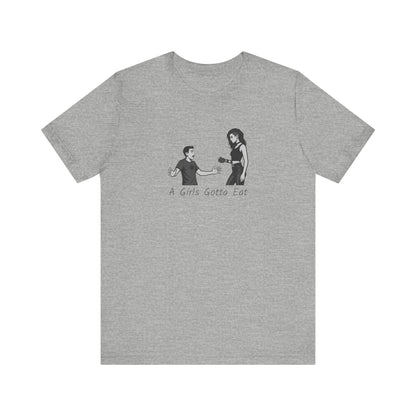 A Girl’s Gotta Eat Shirt – Dark Theme Heartbreaker Tee Featuring a No-Nonsense Queen with Zero Regrets. Unisex Jersey Short Sleeve Tee