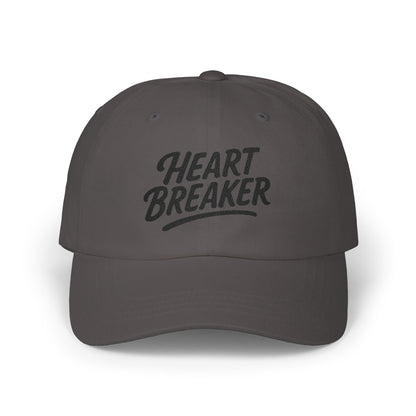 Heartbreaker Embroidered Classic Dad Hat – Bold Baseball Hat with Retro Script and Broken Heart Design for Confident Rule-Breakers. Black Letters