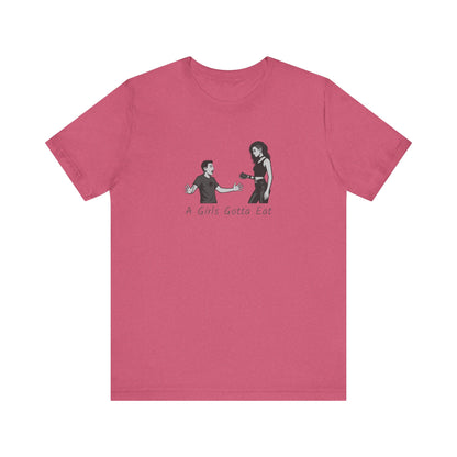 A Girl’s Gotta Eat Shirt – Dark Theme Heartbreaker Tee Featuring a No-Nonsense Queen with Zero Regrets. Unisex Jersey Short Sleeve Tee