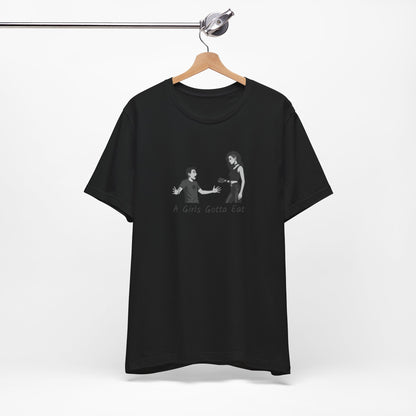 A Girl’s Gotta Eat Shirt – Dark Theme Heartbreaker Tee Featuring a No-Nonsense Queen with Zero Regrets. Unisex Jersey Short Sleeve Tee
