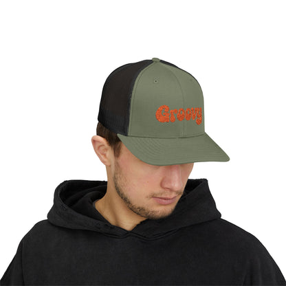 Groovy Trucker Hat – Retro Embroidered Hat with 70s Style Font for Funky Vibes, Chill Days, and Vintage Cool. Orange Letters