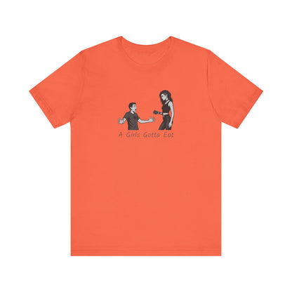 A Girl’s Gotta Eat Shirt – Dark Theme Heartbreaker Tee Featuring a No-Nonsense Queen with Zero Regrets. Unisex Jersey Short Sleeve Tee