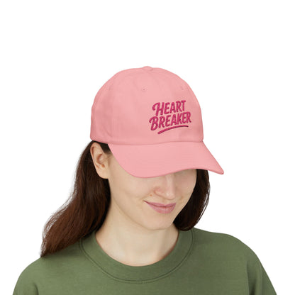 Heartbreaker Embroidered Classic Dad Hat – Bold Baseball Hat with Retro Script and Broken Heart Design for Confident Rule-Breakers. Pink Letters