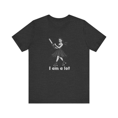 I Am a Lot Shirt – Fierce Skater Girl with Chainsaw in Dark Theme Retro Cartoon Style. Unisex Jersey Short Sleeve Tee