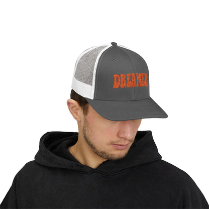 Dreamer Trucker Hat – Embroidered Minimalist Script Hat for Visionaries, Creatives, and Chill Daydreamers. Orange Letters