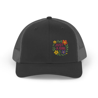 Just a Girl Trucker Hat – Colorful Floral Text Hat with Bold Feminine Style and Summer Vibes