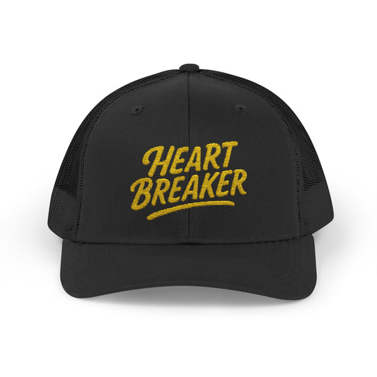 Heartbreaker Trucker Hat – Bold Baseball Hat with Retro Script and Broken Heart Design for Confident Rule-Breakers. Yellow Letters