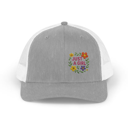Just a Girl Trucker Hat – Colorful Floral Text Hat with Bold Feminine Style and Summer Vibes